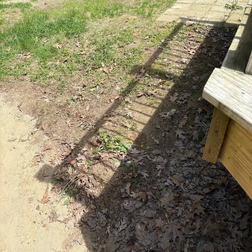 After: The ground beside the deck cleared